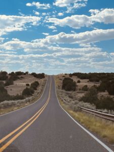 Open road under blue cloudy skies