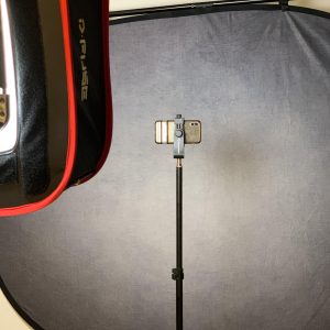 Self-tape setup with phone camera, backdrop, and lights